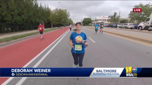 Deb runs into WBAL NewsRadio's Rob Lang on 10K course