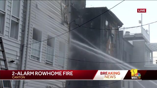 Neighbors evacuate amid rowhome fire in Canton