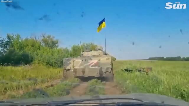 Ukrainian troops capture and fly flag from Russian Z tank