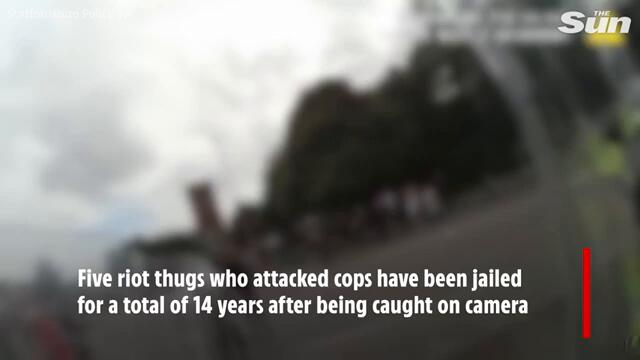 Riot thugs caught on camera attacking cops jailed for a total of 14-years