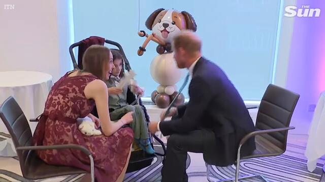 Prince Harry makes sick kids smile at awards ceremony on trip back to UK without Meghan