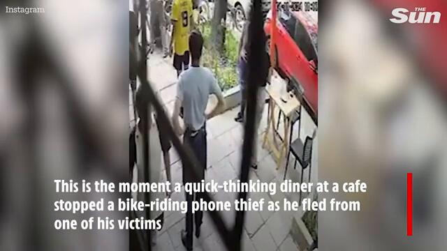 Heroic diner hurls chair at bike-riding phone thief sending him crashing to the ground
