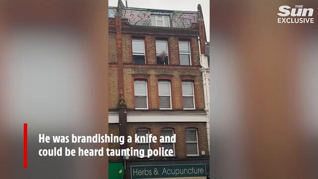 Armed cops descend as shirtless man waving knife shouts 'I have hostages'